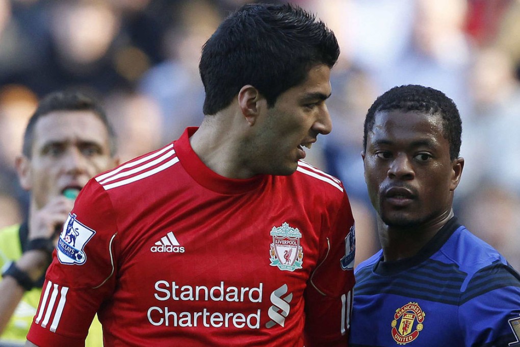 Liverpool's Luis Suarez (left) was caught racially abusing Manchester United's Patrice Evra (right) during their English Premier League match at Anfield. Photo: Reuters