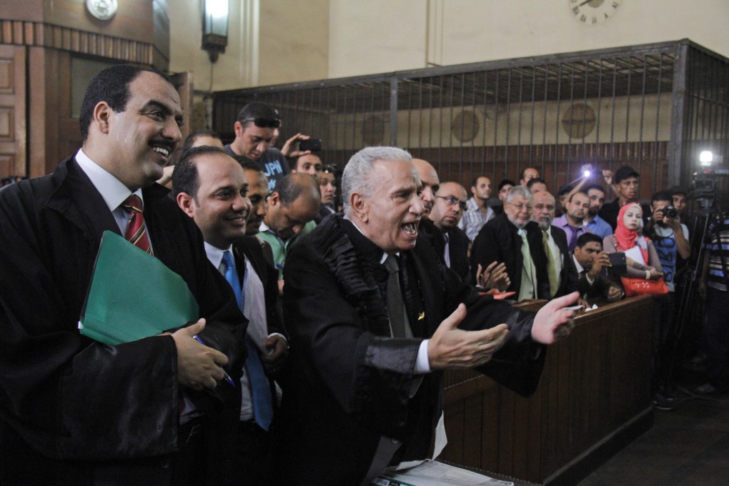 Lawyers for Muslim Brotherhood leaders appear in courtroom in Cairo. Photo: AP