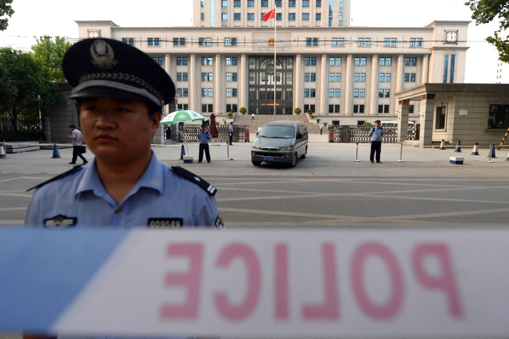 A policeman stands guard during the trial of disgraced politician Bo Xilai at the Intermediate People's Court in Jinan. Photo: AFP