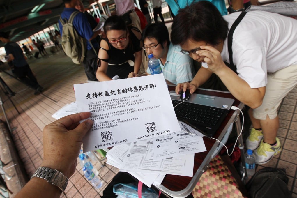 Supporters of Alpais Lam collect signatures for a petition in support of her, as her detractors keep up the pressure. Photo: David Wong