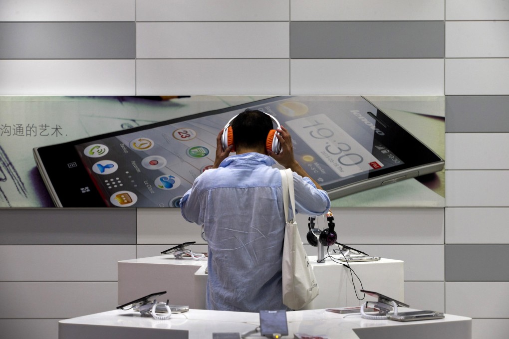 Customers are free to play with products in Lenovo stores. Photo: AP