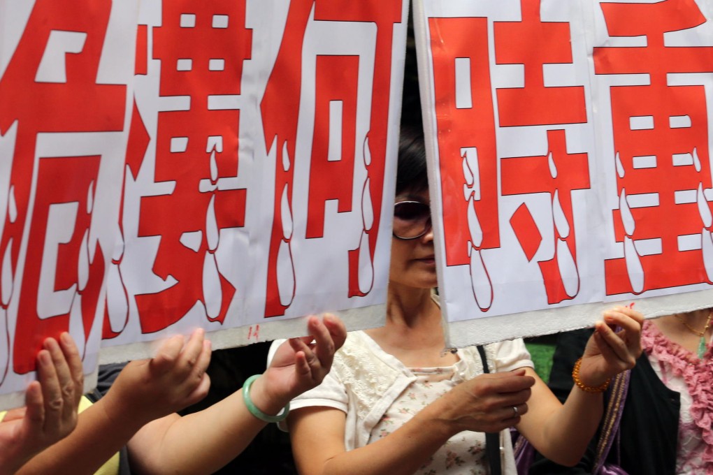 Residents protest at the URA