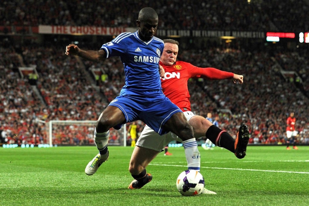 Manchester United striker Wayne Rooney tackles Chelsea midfielder Ramires in their Premier League match at Old Trafford. Photo: AFP