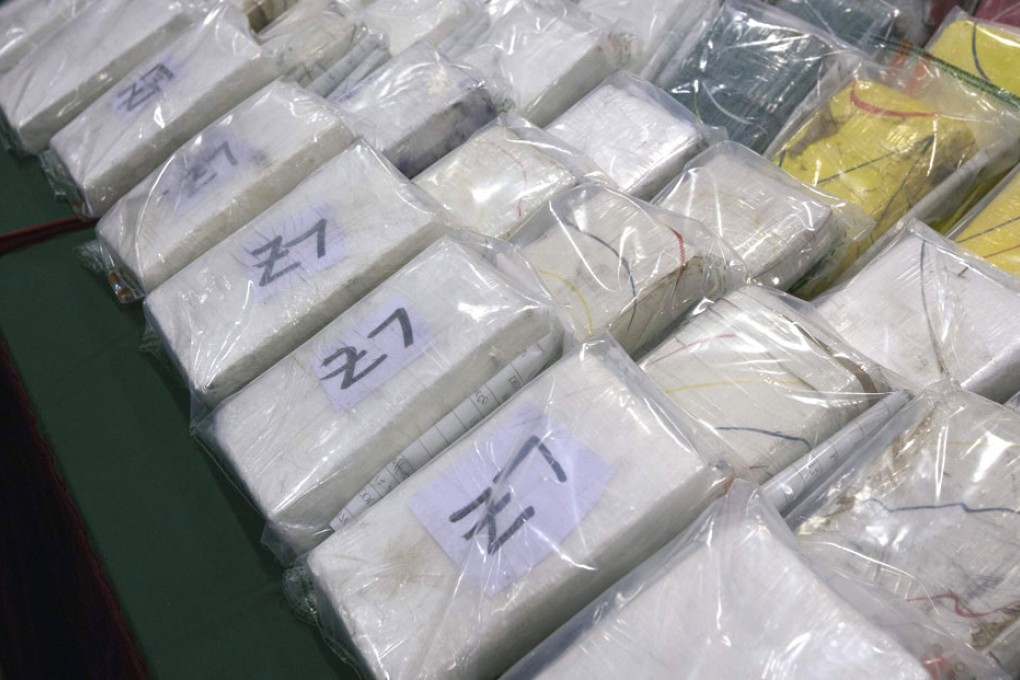 Customs officers have seized a total of 60 kilograms of cocaine from two passengers at the airport on August 14, 2013. Photo: Reuters