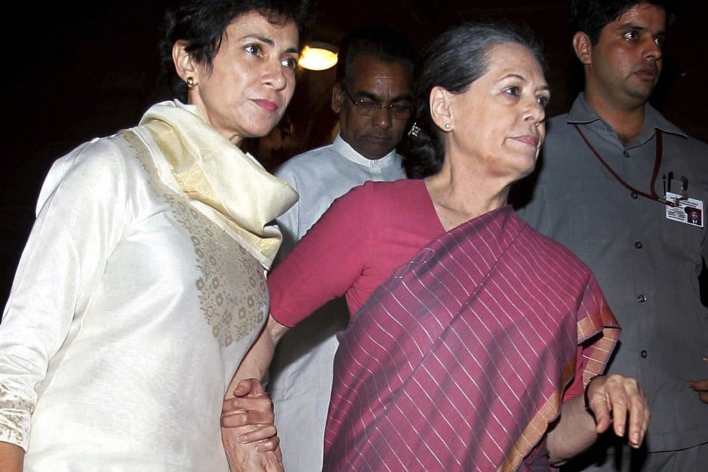 Indian Social Justice minister Kumari Selja (left) escorts chairwoman of ruling United Progressive Alliance and Congress party president Sonia Gandhi, who has fallen ill.