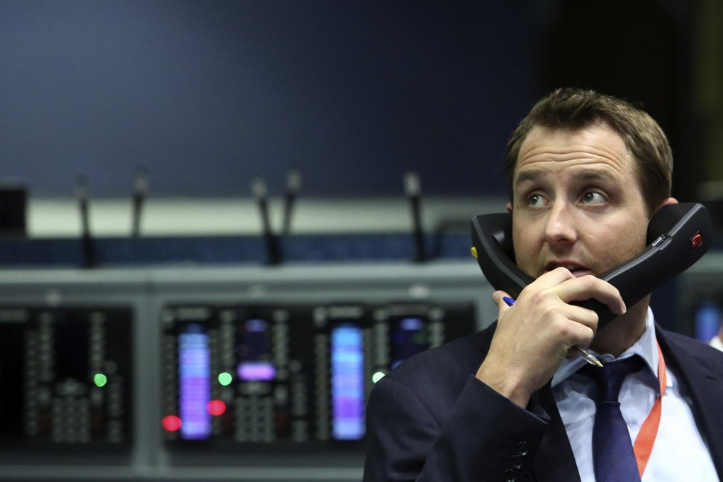 A trader handles business at the London Metal Exchange, which is facing lawsuits for alleged anti-competitive behaviour. Photo: Bloomberg