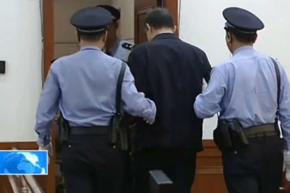 Bo Xilai is escorted out of court at the end of the fourth day of his trial. Photo: SCMP