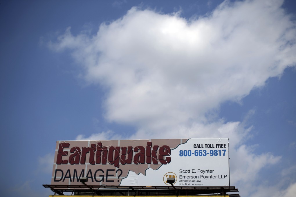 A law firm billboard invites plaintiffs to join a lawsuit against two oil companies near Greenbrier, Arkansas. Photo: Reuters