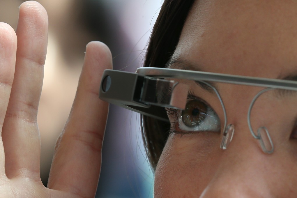 Early testers of Google Glass had to pay US$1,500 for the device, but Google hopes to bring that price down by the time of its mass-market release next year. Photo: AFP