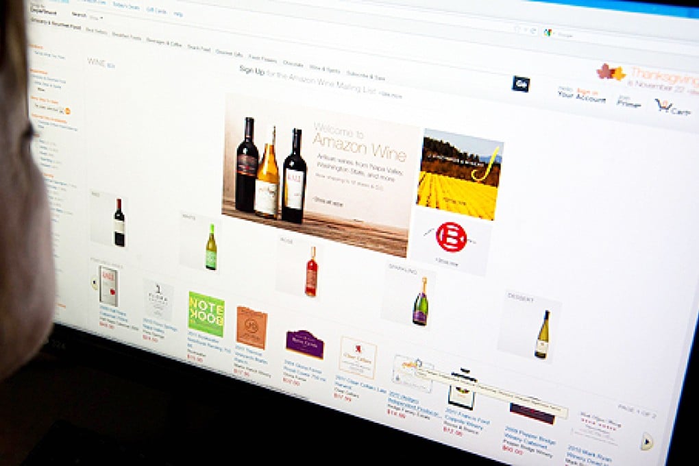 A woman shops for wine online. Photo: AFP