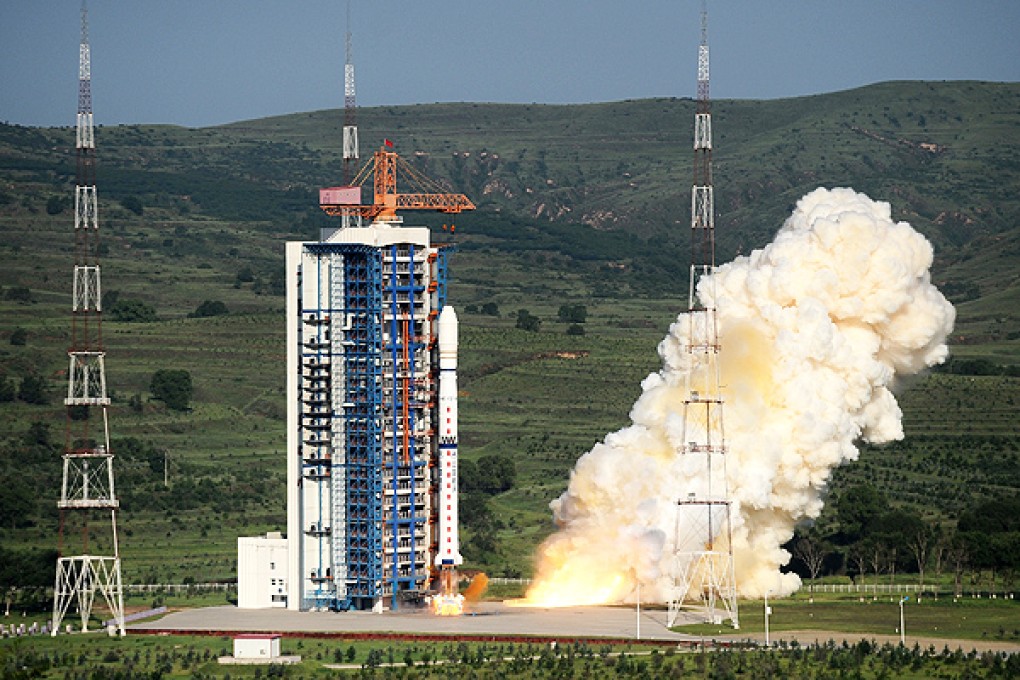 A Long March-4C carrier rocket blasts off from the launch pad in the Taiyuan Satellite Launch Centre in Shanxi province on July 20, 2013. Photo: Xinhua