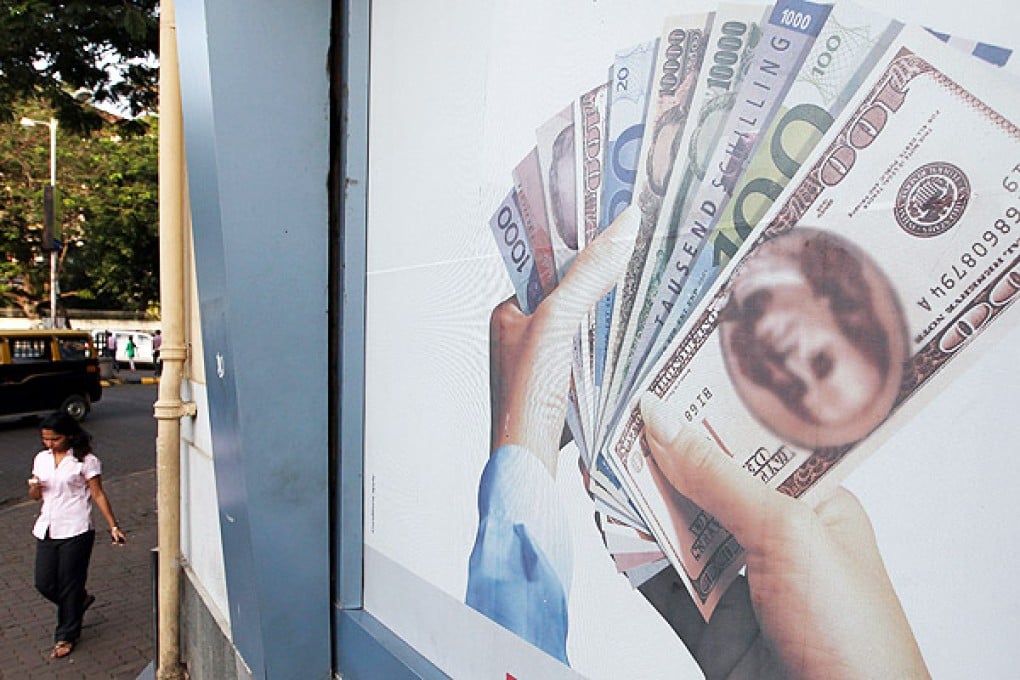 The rupee continued its slide against US dollar, falling almost 4pc yesterday. Photo: EPA