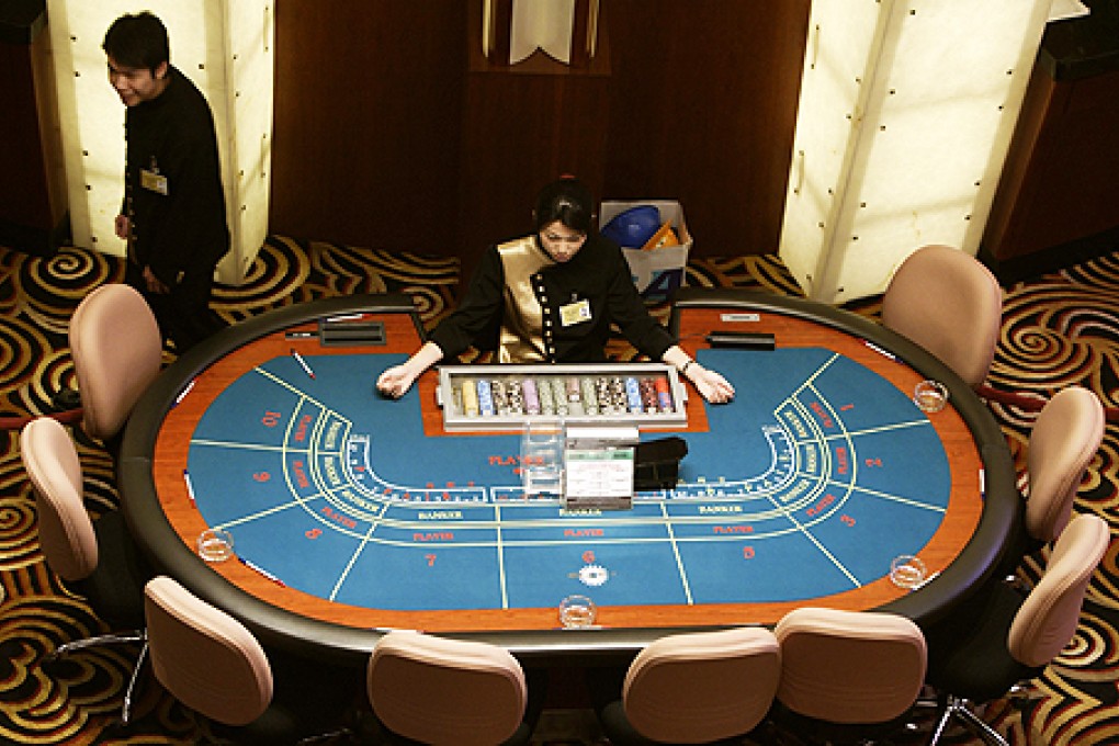 Gamblers who fail to pay casino debts in Macau risk being branded with negative monikers and having personal details made public by a website. Photo: Reuters