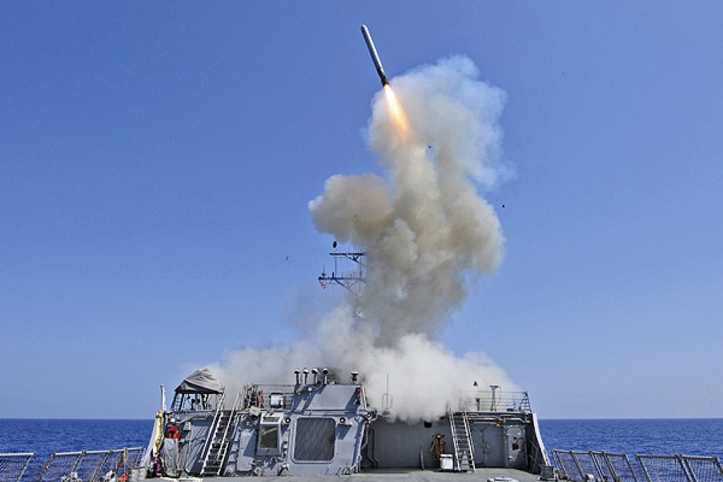 USS Barry launching a Tomahawk cruise missile in the Mediterranean. Photo: Reuters