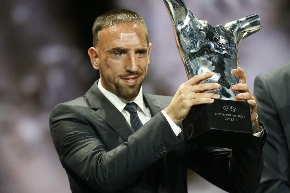 Bayern Munich and France midfield Franck Ribery holds his award trophy after the Champions League draw in Monaco. Photo: AFP