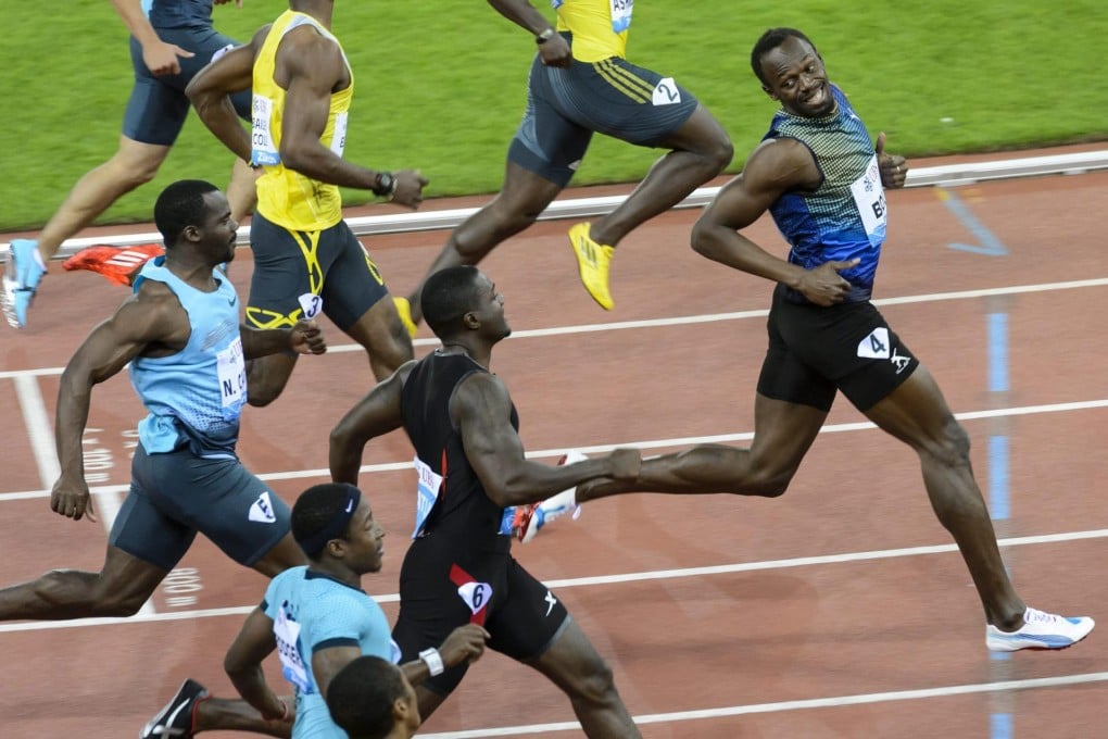 Usain Bolt looks back and smiles at his rivals as he wins the 100m in Zurich despite an unconvincing start. Photo: EPA