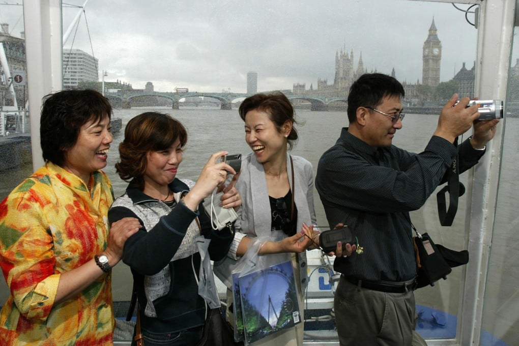 Chinese tourists on the River Thames in London. Photo: Reuters