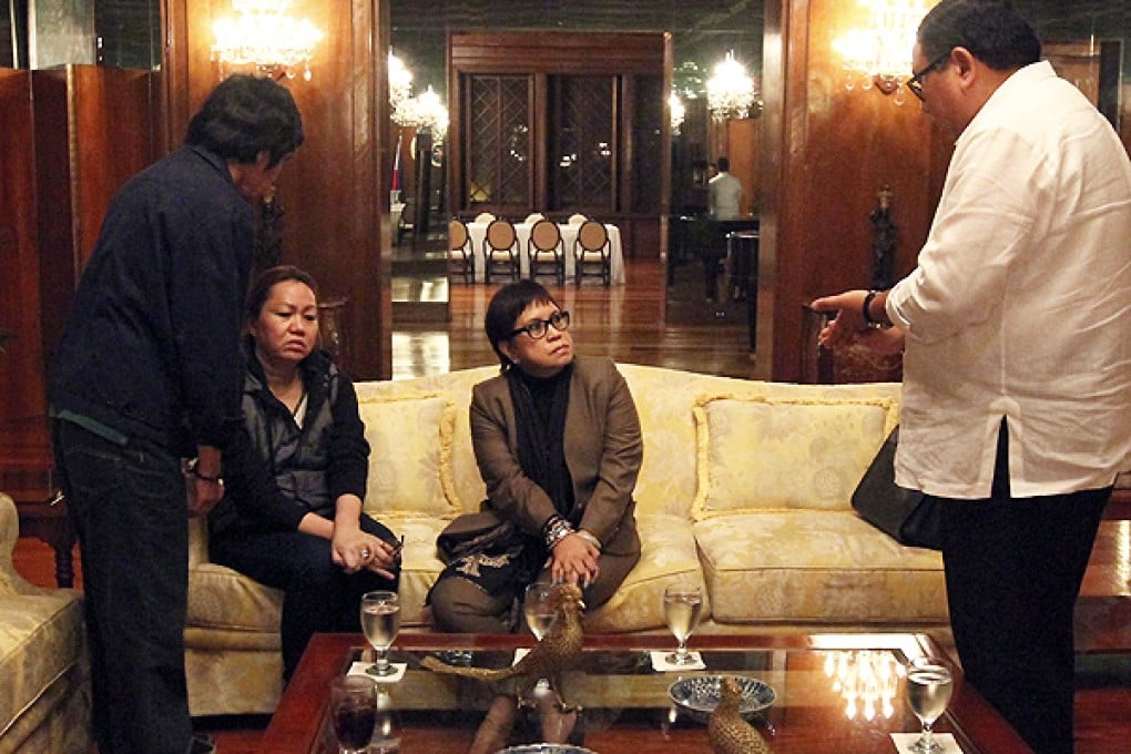 Napoles after she marched into the presidential palace to surrender. Photo: AFP