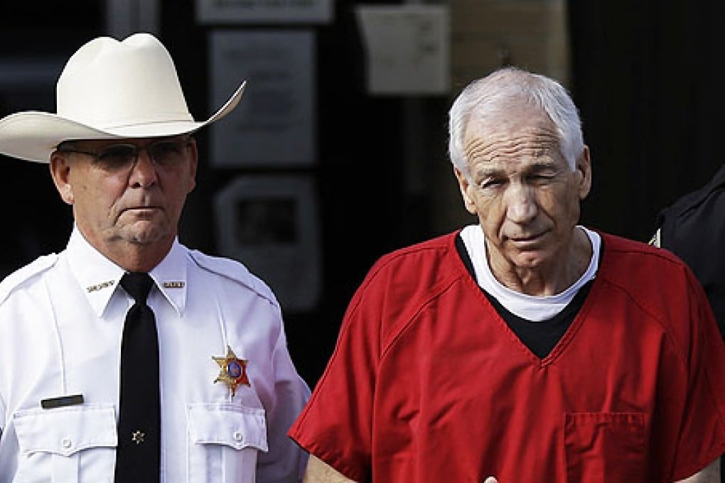Former Penn State American football coach Jerry Sandusky (right) was convicted in 2012 of abusing boys at the college. Photo: AP