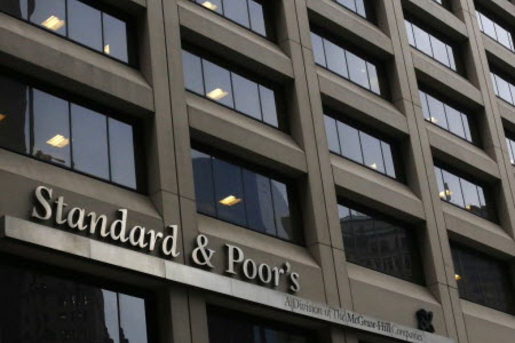 Standard & Poor's sees mainland banks merging as bad loans rise. Photo: Reuters