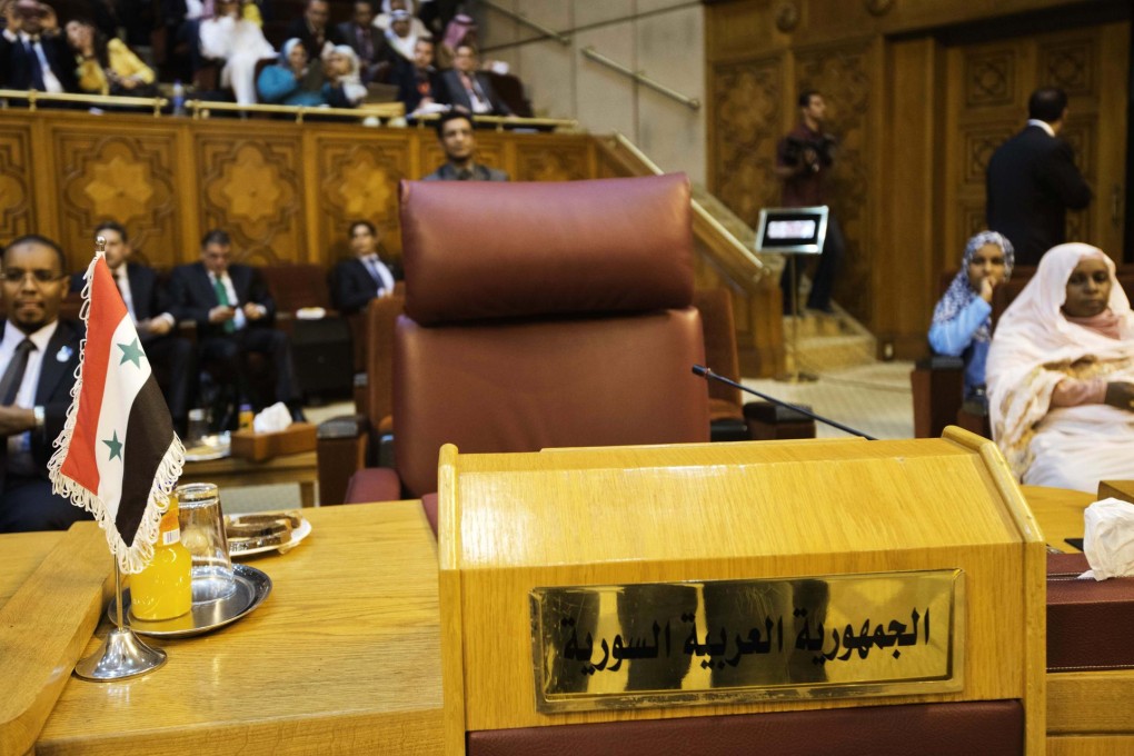 The chair of the Syrian representative sits empty during a meeting of the Arab League in Cairo. Photo: AFP