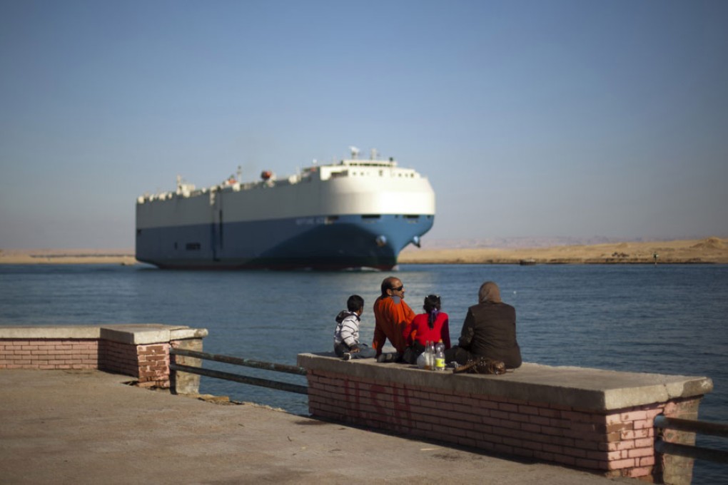 A cargo ship transits the Suez Canal en route from the Mediterranean Sea to the Gulf of Suez. Photo: AP