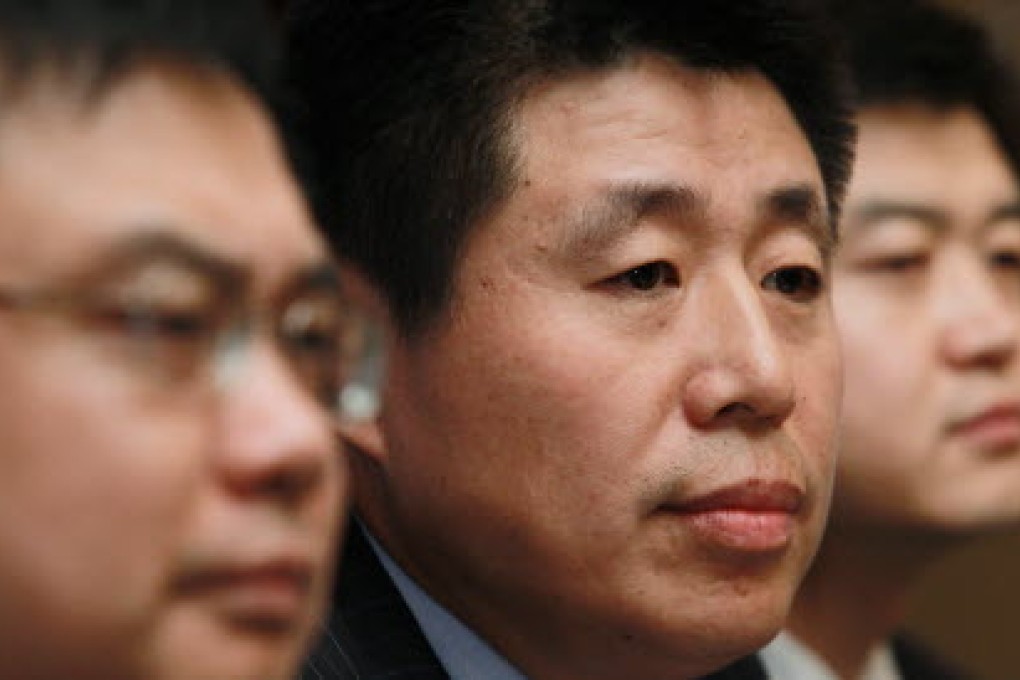 Frank Dai Mingfang (centre), Chairman of Hanergy Solar. Photo: Edward Wong