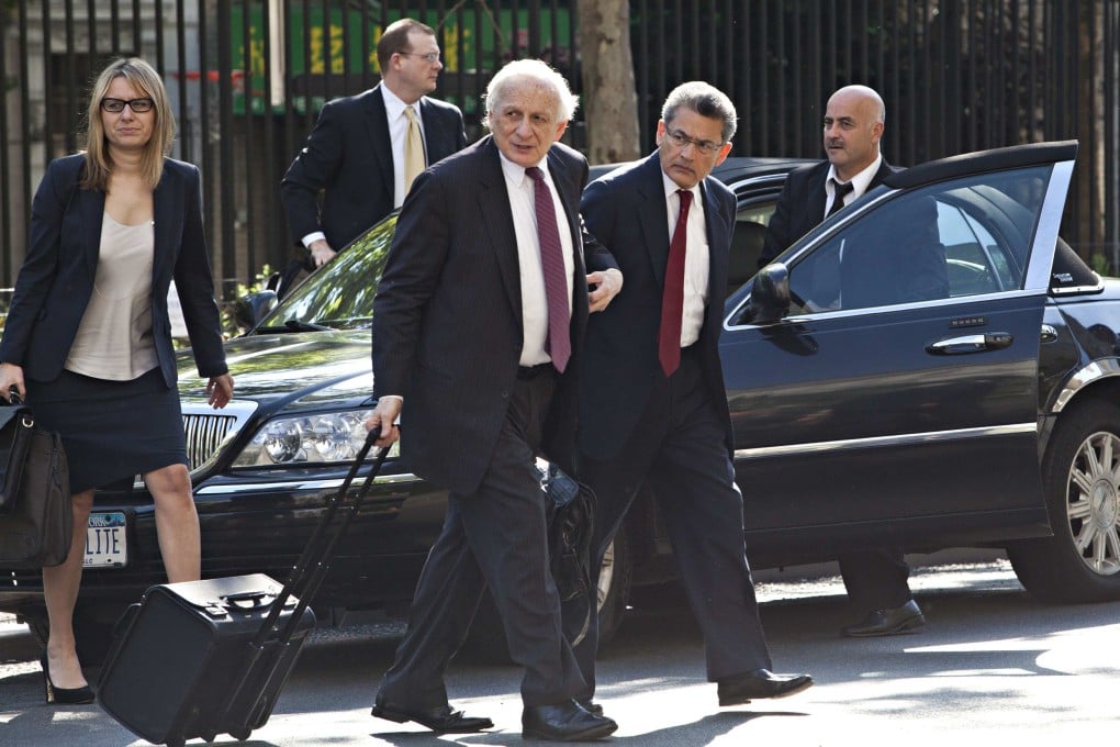 Rajat Gupta (front right), a former Goldman Sachs board member, arrives at Manhattan Federal Court in this May 2012. Expert networks, a matchmaking service linking investors with company insiders, are under scrutiny from regulators in the United States, but are expanding across Asia. Photo: Reuters