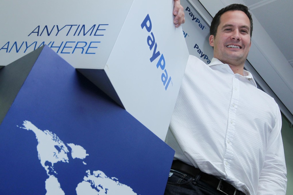 PayPal's James Mirfin announces the new security measures at the company's Wan Chai office yesterday. Photo: Edward Wong