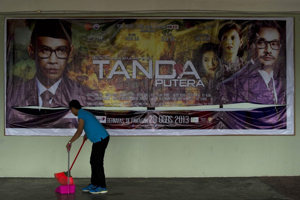 A poster for Tanda Putera in Kuala Lumpur. The film has stirred racial sentiment over the depiction of the ethnic Chinese minority as the aggressors in the 1969 riots. Photo: AFP