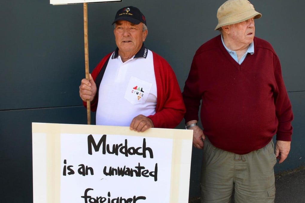 Retired unionists hold a rally outside News Corp Australia headquarters in Sydney. Photo: AFP