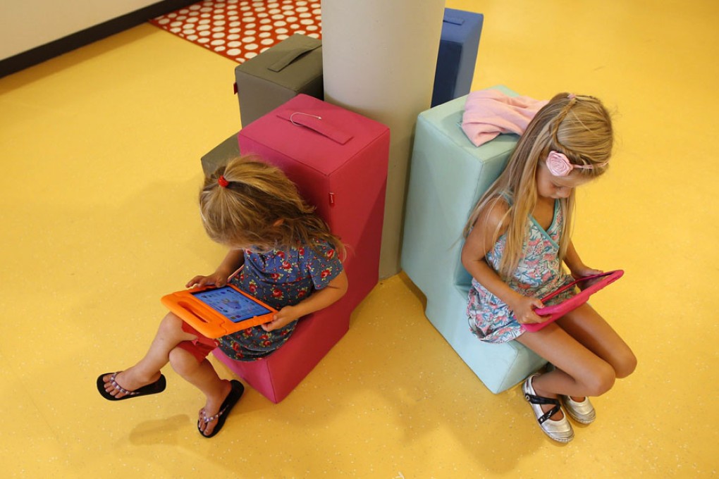 Pupils use iPads at a school in Sneek, in the Netherlands. Some experts remain cautious about the use of technology in learning. Photo: AFP