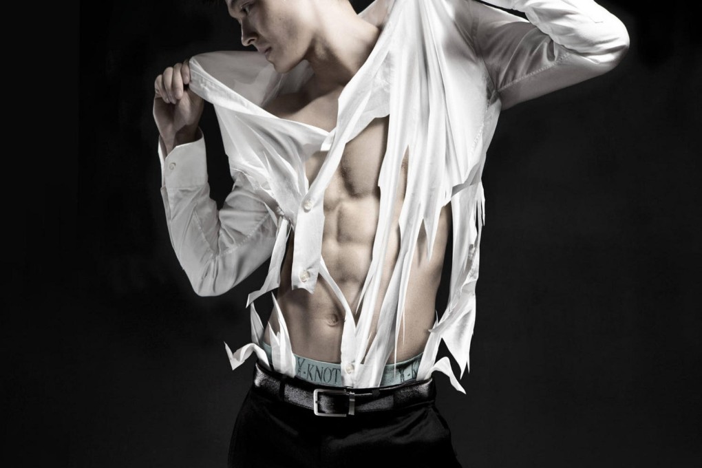 A model - perhaps wearing a shirt that is on the flimsy side - attempts to extricate his top from his Y-Knot boxers, only to discover how sticky they really are.