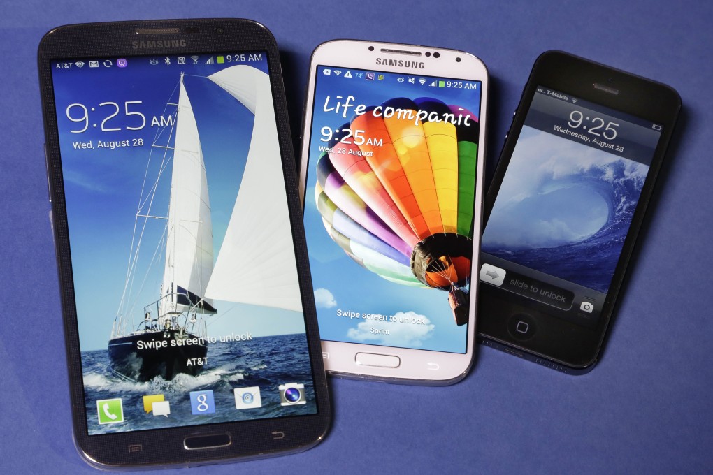 The Samsung Galaxy Mega (left) dwarfs the Samsung Galaxy S4 (centre) and Apple iPhone 5 (right). Almost as big as a conventional tablet computer, the Mega can make phone calls. Photo: AP