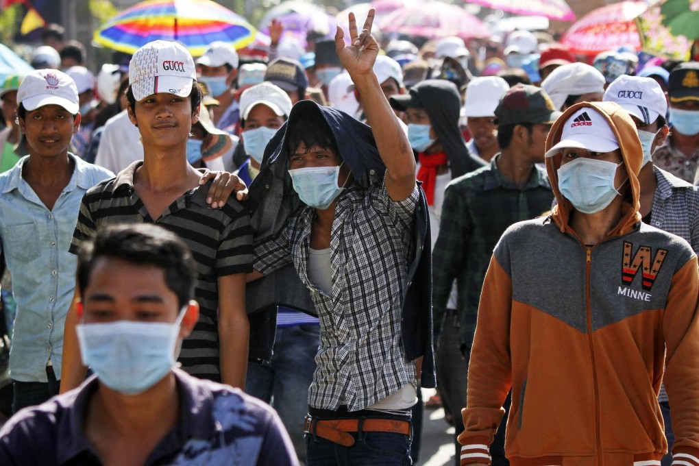 Garment workers march to City Hall in Phnom Penh. Workers earn around US$110 a month. Photo: Reuters