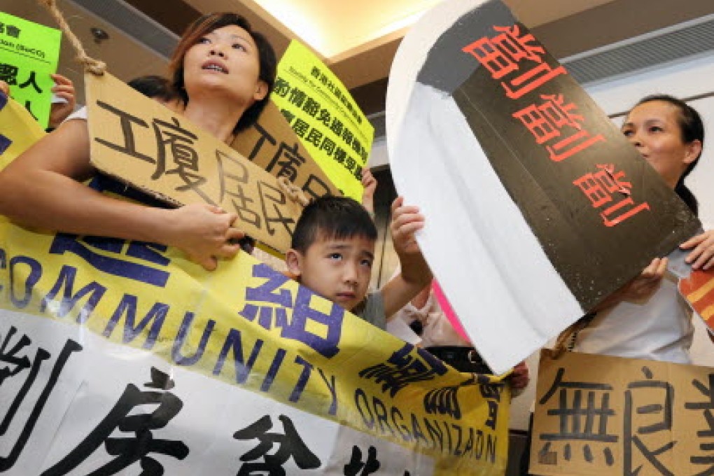 Society for Community Organization stages a protest at Community Care Fund office, demanding subsidy to residents of cubicles in industrial buildings. Photo: Felix Wong