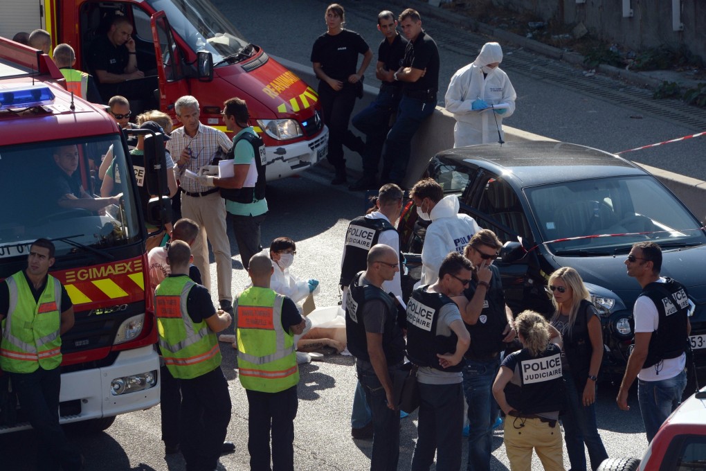 Forensic experts and police inspect the scene where Adrien Anigo, son of the Olympique de Marseille football team manager Jose Anigo, was shot dead by two men on a motorbike in Marseille, France. Photo: AFP