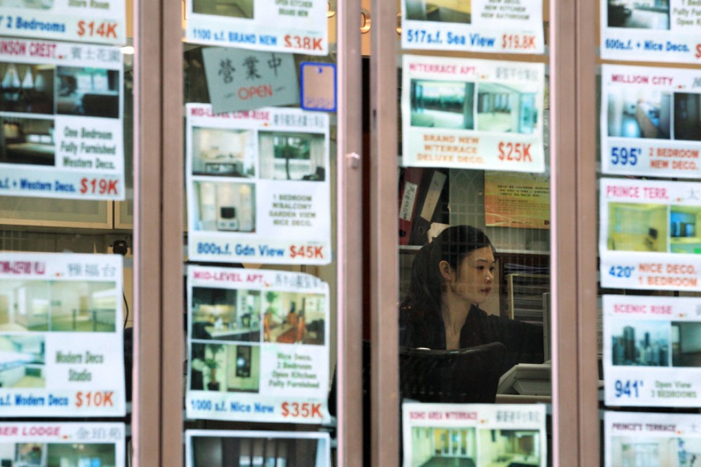 An alliance of property agents will withdraw their newspaper advertisements on Monday to protest against the government's market-cooling measures. Photo: AFP