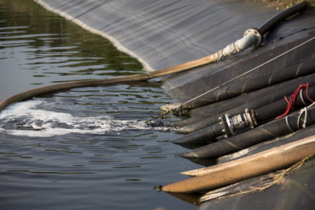 Leak in one of the leachate lagoons of the North East New Territories Landfill has resulted in an overflow of leachate into the Kong Yiu River. Photo: EPA