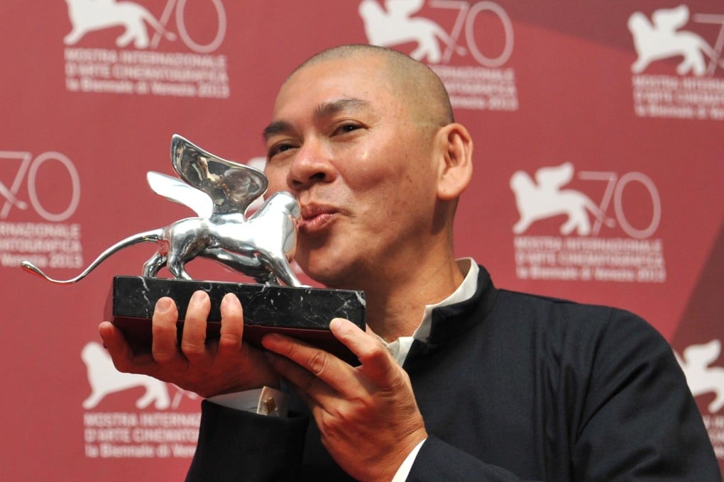Tsai Ming-liang embraces his Grand Jury Prize. Photo: AFP