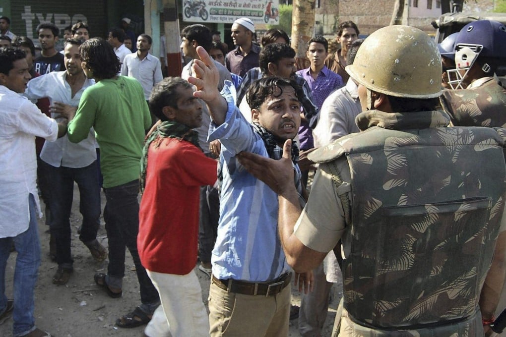 Residents argue with police following clashes in Muzaffarnagar in Uttar Pradesh. Photo: AP