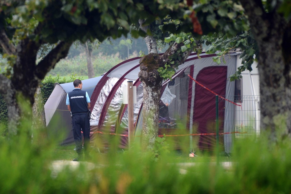 A French gendarme stands guard near the caravan of the British family hit by gun attack on September 6, 2012. Police say they are making progress in the investigation. Photo: AFP
