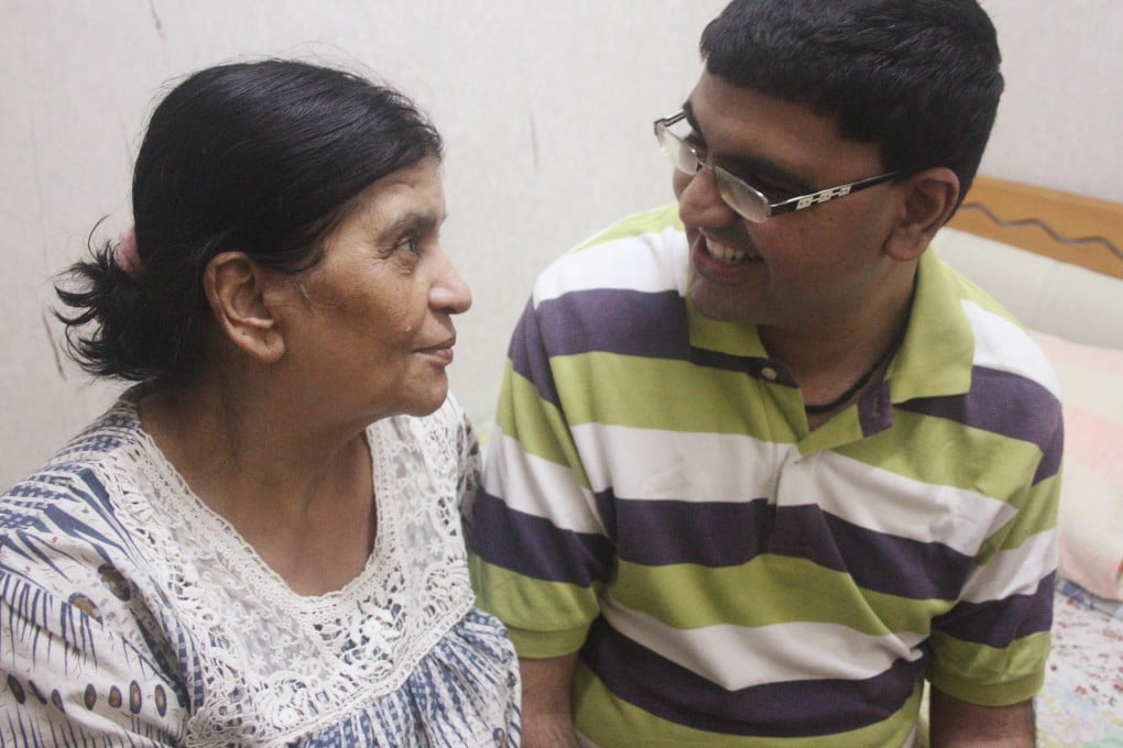 Prakash Punjabi and his mother Indira who helps to feed him when he no longer has the energy to do so himself. Photo: Annemarie Evans