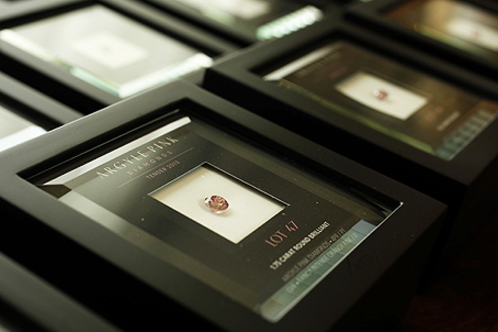 Rio Tinto pink diamonds are displayed in boxes. Photo: Reuters