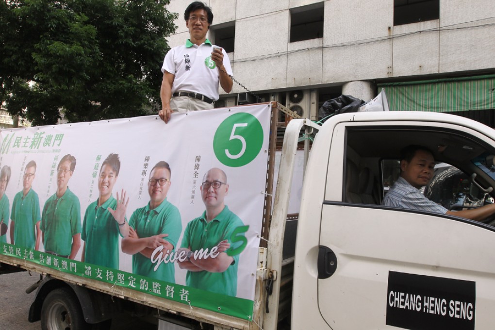 Campaign vehicles armed with loudspeakers are rolling through the streets of Macau. Photo: Edward Wong