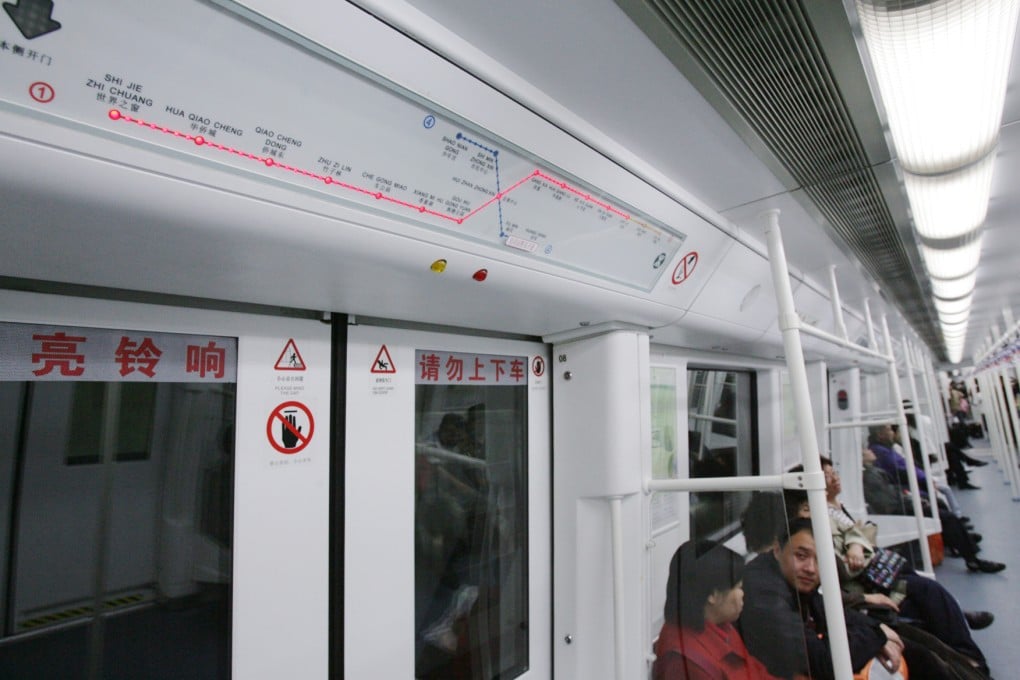 A woman was squeezed out from a Shenzhen metro carriage after doors opened suddenly. Photo: Edward Wong