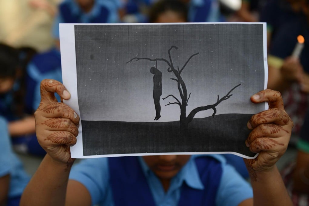 A schoolgirl in India holds up a poster in a protest at the fatal gang-rape of a student in New Delhi. The crime focused attention on sexual violence in Asian societies. Photo: AFP