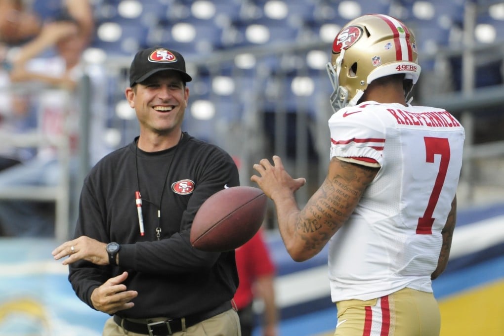 San Francisco 49ers head coach Jim Harbaugh (left). Photo: AP
