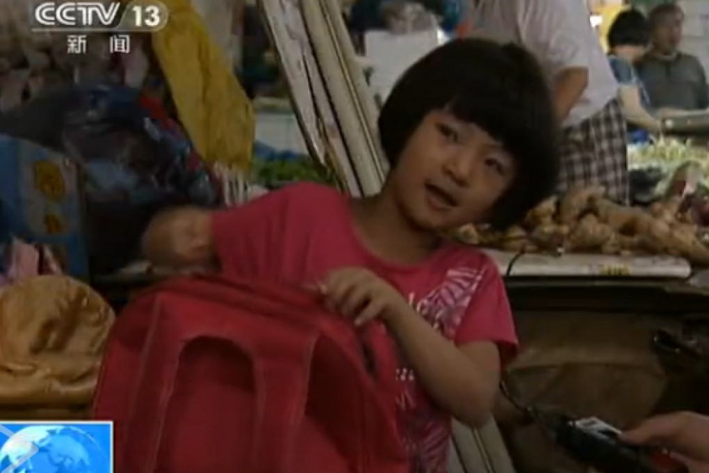 Diao Qianwen, a six-year-old girl, lives with immigrant worker grandparents in a wet market in Shanghai. Photo: screenshot