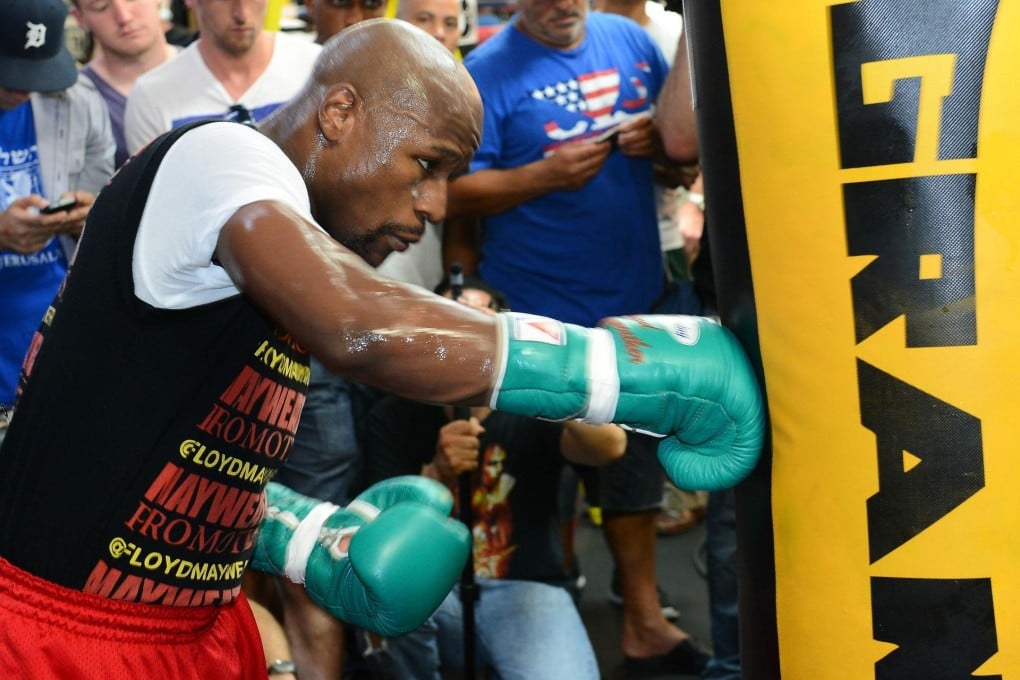 Floyd Mayweather Jnr works out on the bag at his club. Photo: AFP